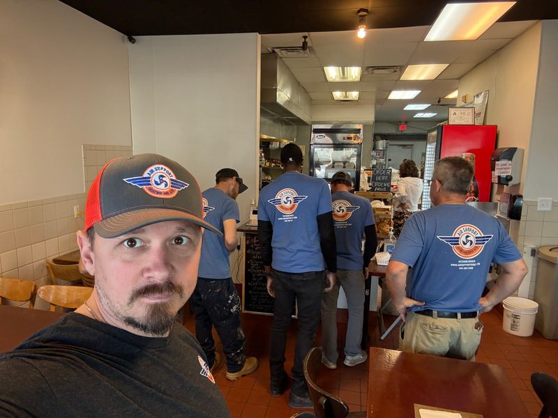 Air Support Heating and Air team members taking a break at a local Wilmington restaurant