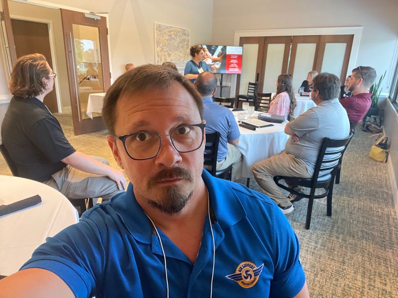 Air Support team members at a Daikin training event reviewing technical materials