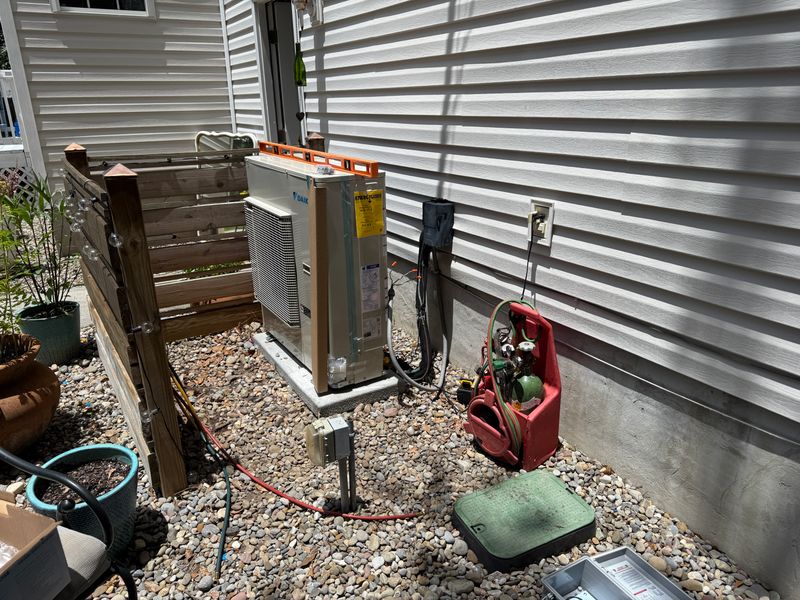 Daikin heat pump package unit being installed at a residential home