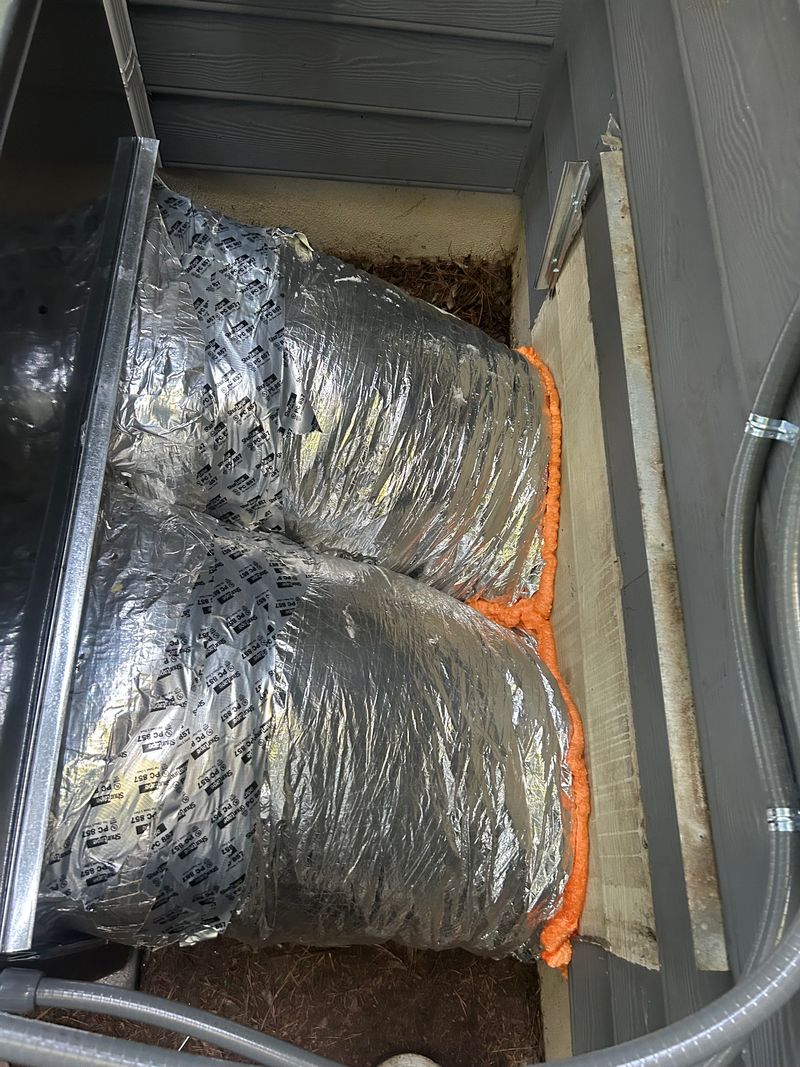 Insulated flex duct connections in a crawlspace attached to an HVAC plenum